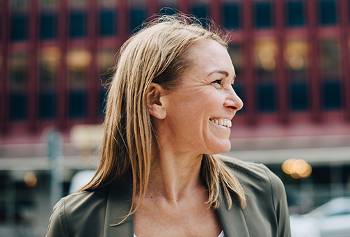 Woman smiling looking to the side